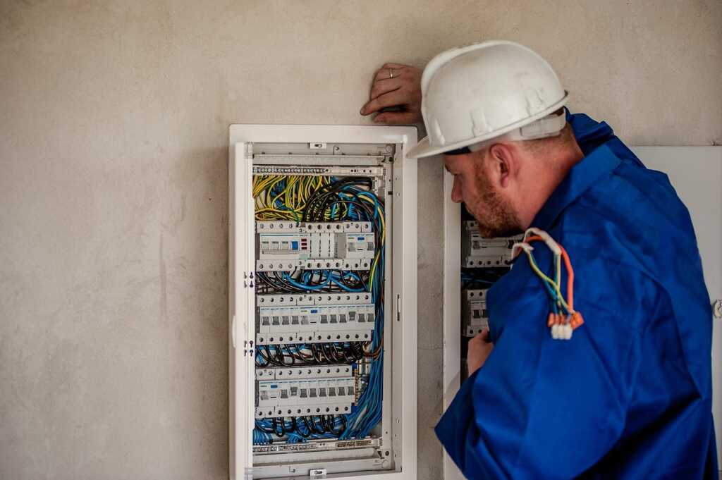 Residential electrician upgrading an electrical panel in a Richmond Hill home.